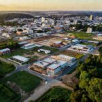 Vista aérea de Presidente Médici mostrando expansão urbana e crescimento econômico